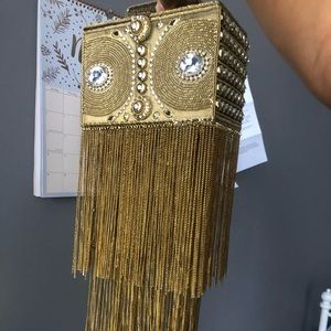 Golden bag with tassels